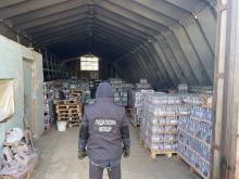 Боротьба з виробництвом закарпатського фальсифікату: виявлений ангар “лівих” лікеро-горілчаних виробів